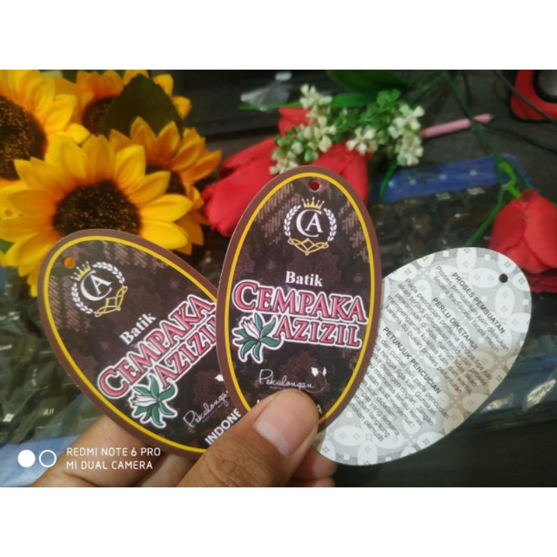 

jasa melubangi kertas hangtag untuk 500pcs