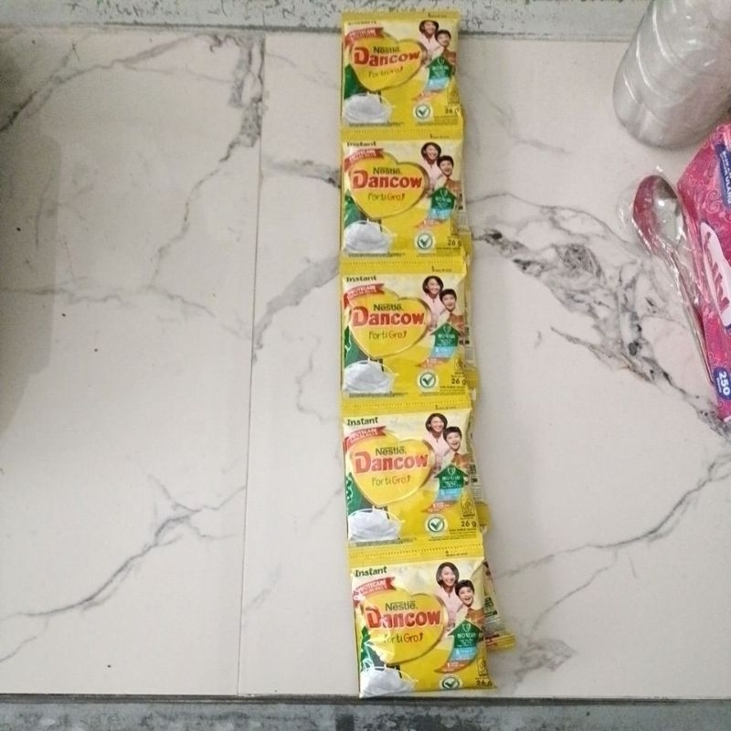 

Dencow 1 renteng isi 10 biji susu bubuk instan