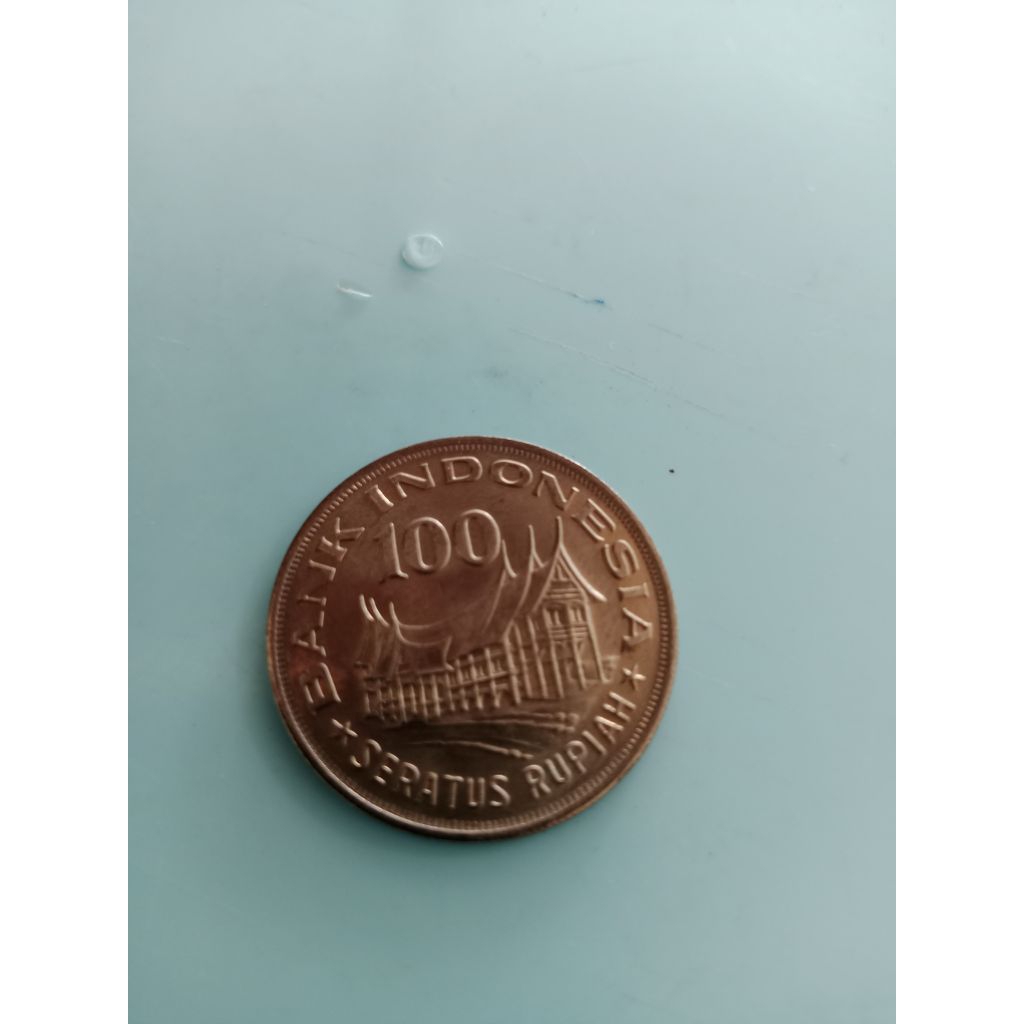 koin 100 rupiah rumah gadang