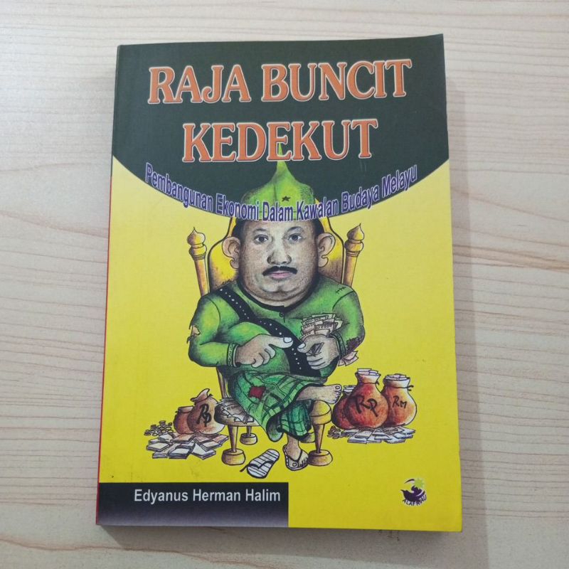 BUKU RAJA BUNCIT KEDEKUT PEMBANGUNAN EKONOMI DALAM KAWALAN BUDAYA MELAYU OLEH EDYANUS HERMAN HALIM