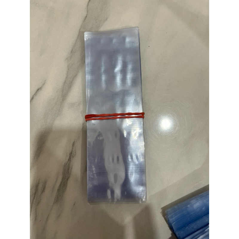 

PLASTIK SEGEL (SEAL SHRINK) untuk segel toples tabung kue kering diameter 9cm 10cm 1pack isi 50 pcs 15x5cm bening polos