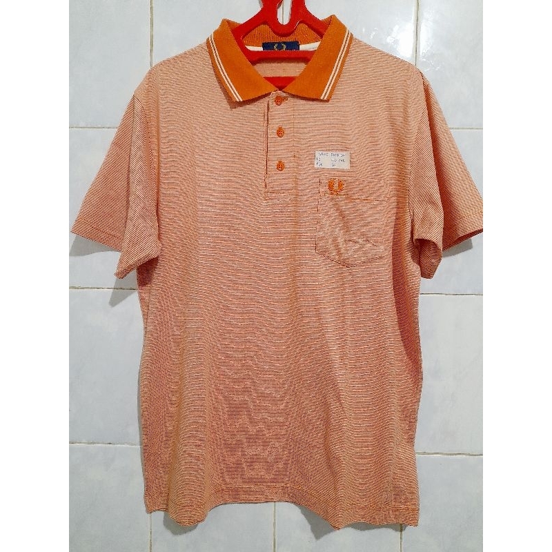 Kaos kerah orange pria