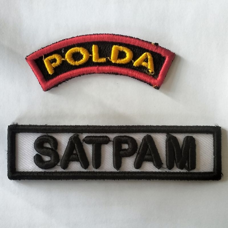 bordir timbul Polda dan satpam