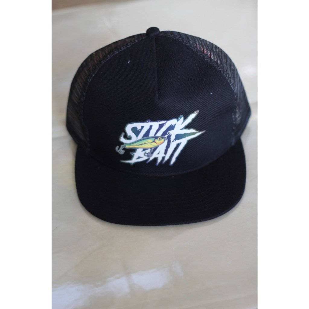 Topi trucker mancing "stick bait"