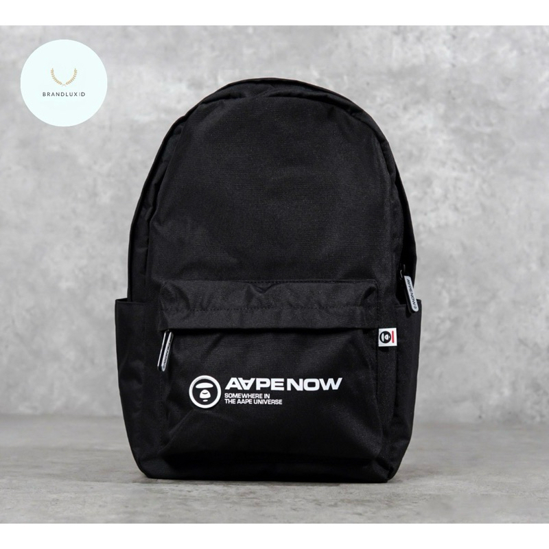 Aape by A Bathing Ape Now Text Basic Logo White Backpack in Black & Taupe