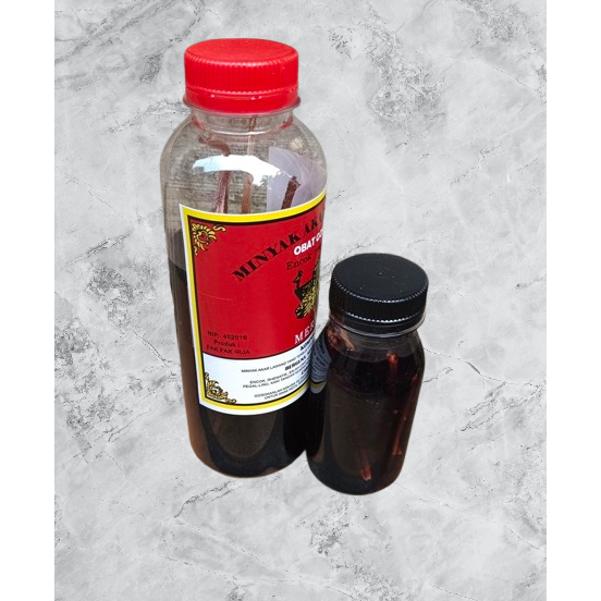 80ml minyak pijat akar lawang ; minyak akar lawang ; minyak pijat kalimantan ; minyak pijet akar law