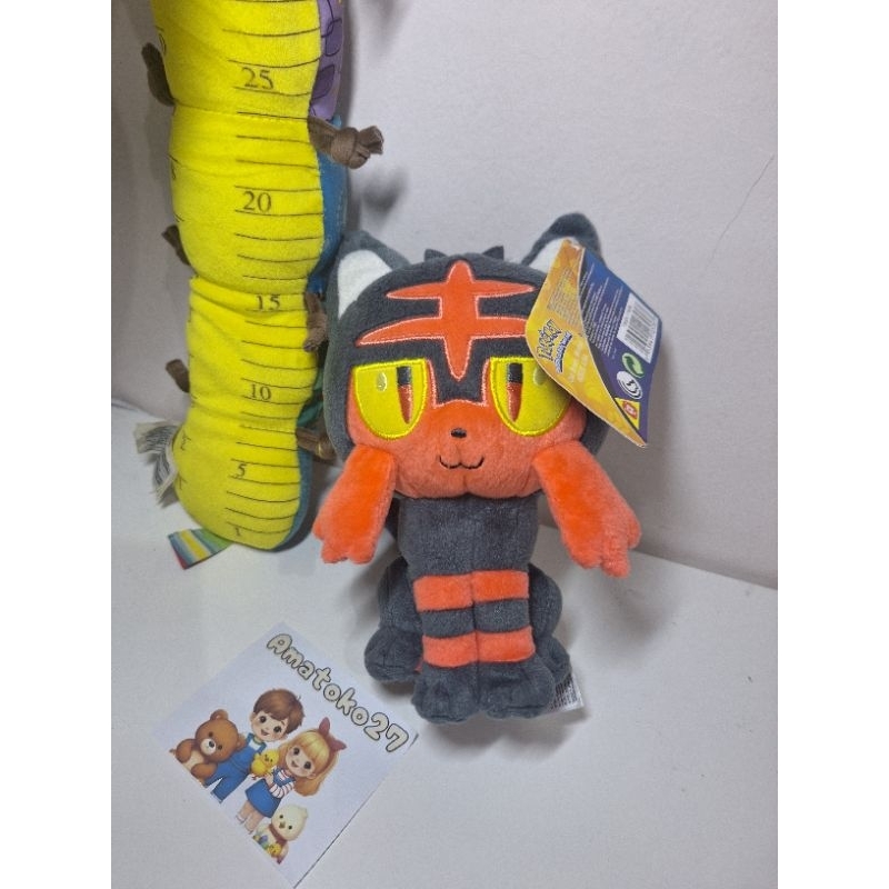 Boneka pokemon sitting litten