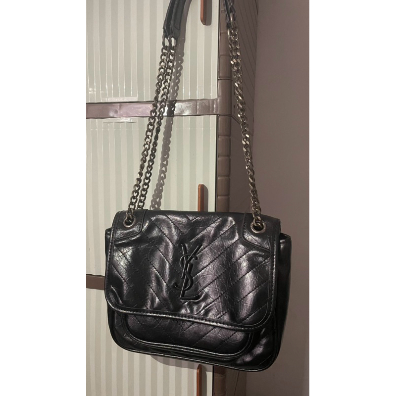 tas ySl niki