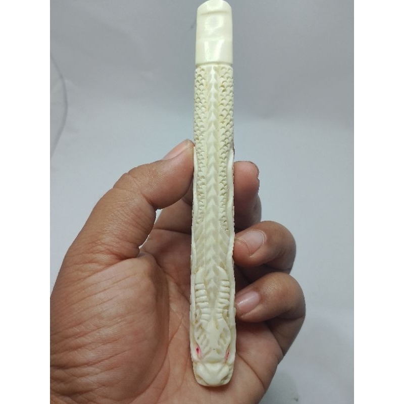 once ukir motif naga