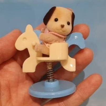 Sylvanian beagle baby with rocking horse