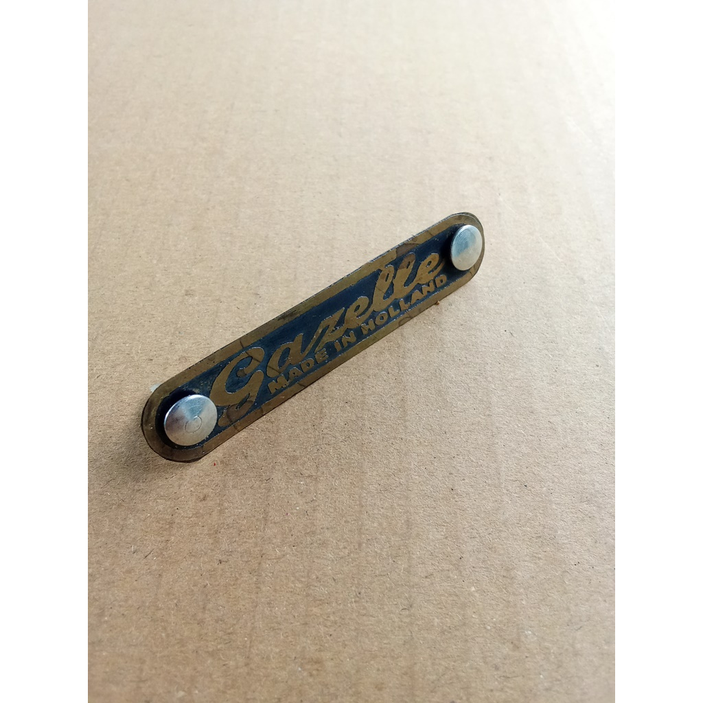 Emblem sadel sepeda onthel merk gazelle Latin