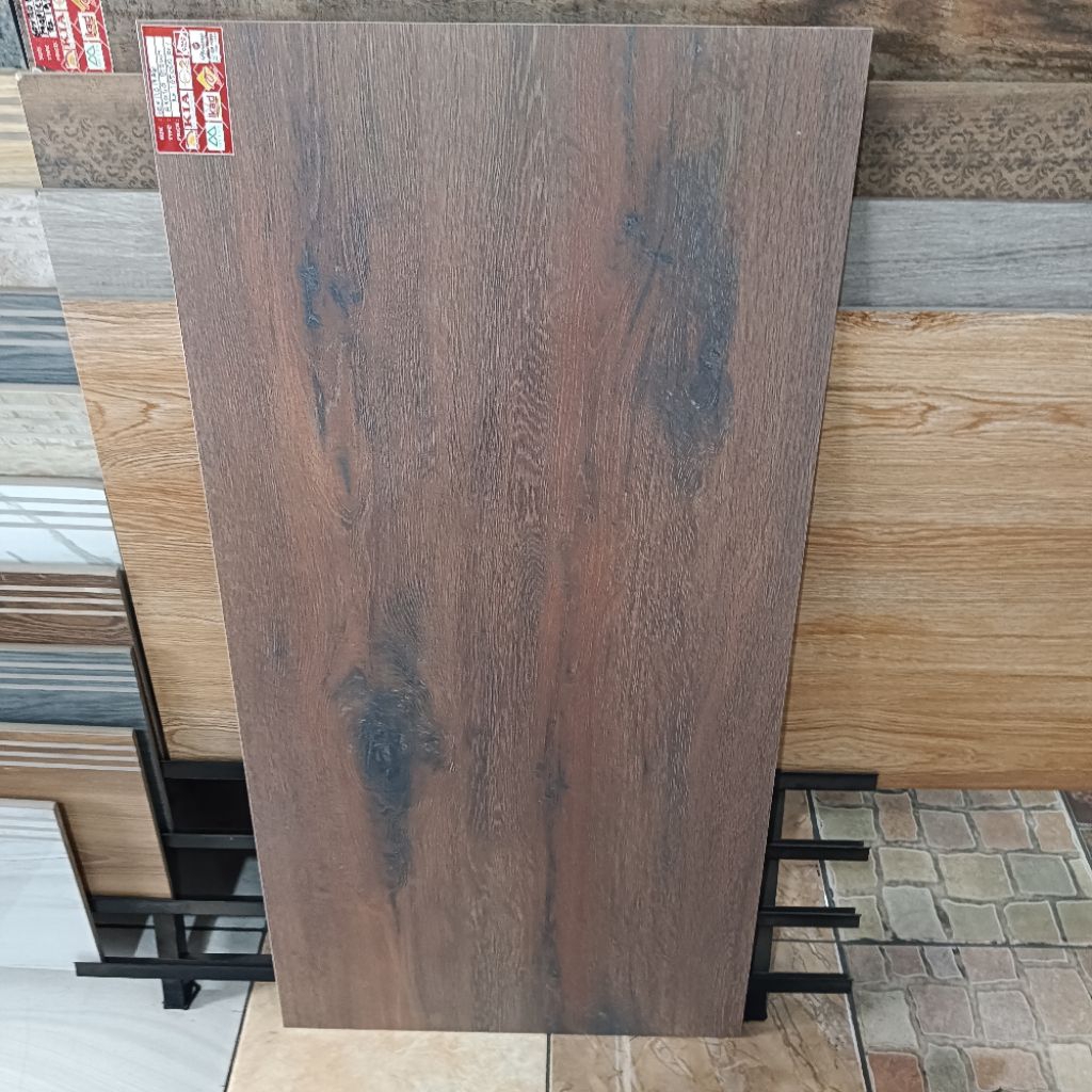 Granit lantai 60x120 motif kayu akasia brown ikad