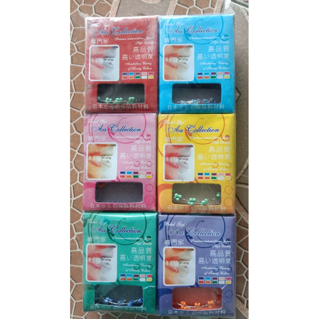 12 pcs mainan behel gigi lepas pasang