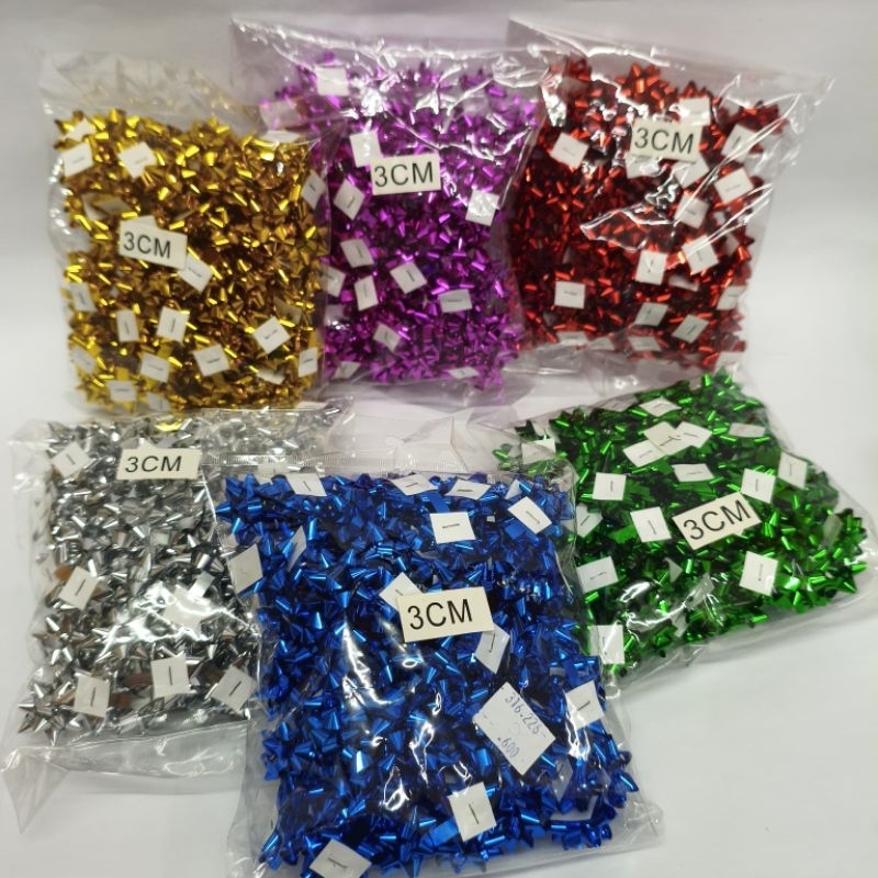 

Bunga tempel warna warni / bunga kado / bunga plastik / bunga pita dekorasi
