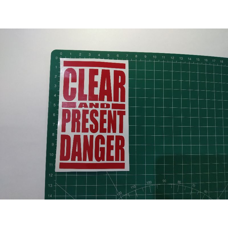 

stiker cutting clear and present danger