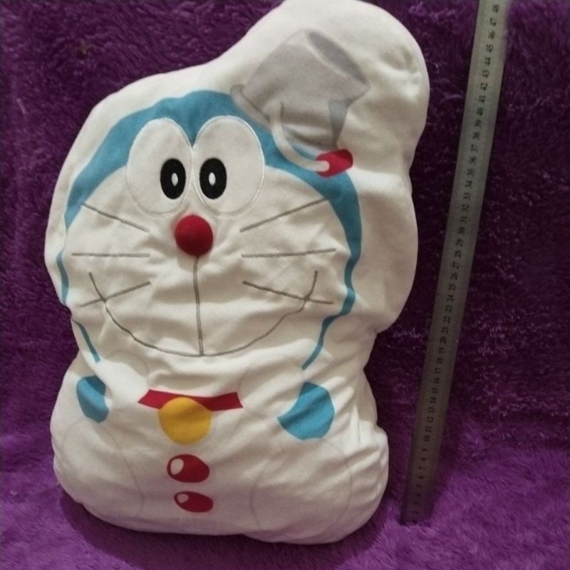boneka  doraemon tempat balmut