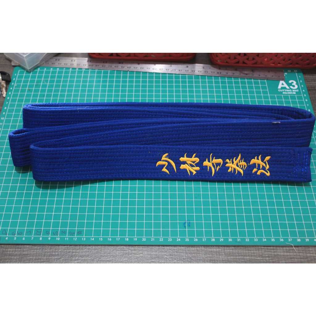 Sabuk/obi Kyu II tebal bordir huruf kanji Shorinji Kempo