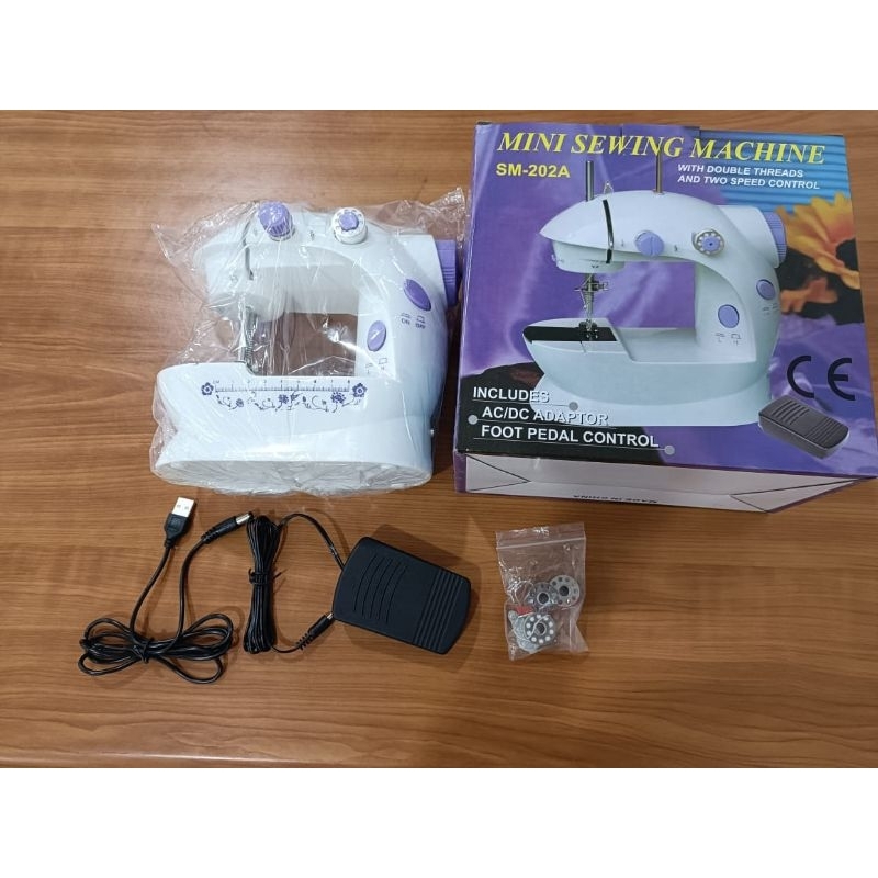 Mesin Jahit Mini Portable Lengkap dengan Lampu dan Adaptor Jarum Jahit