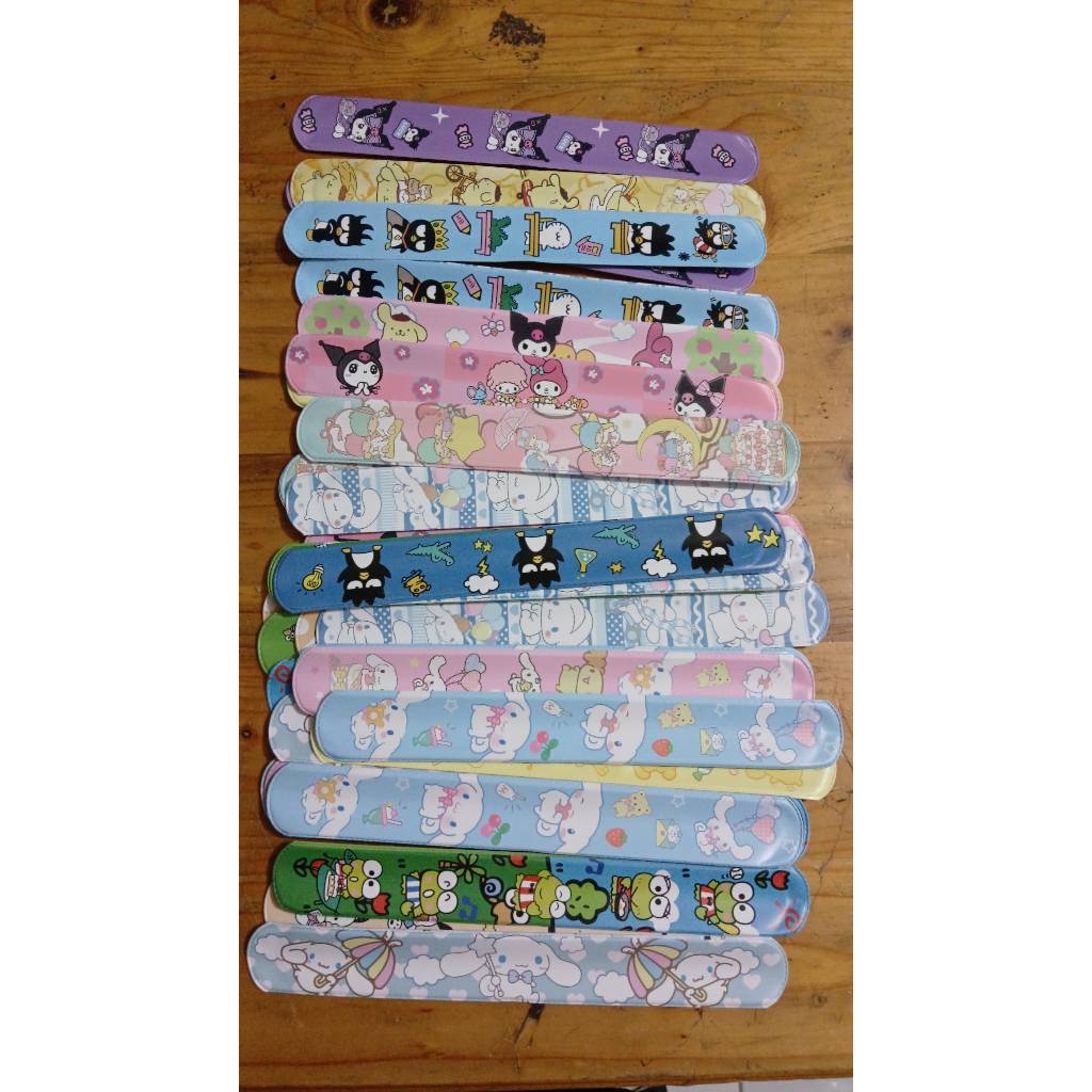 

HJK Grosir 50 Pcs Mainan Gelang Penggaris/Gelang Lipat/Gelang Bisa Digulung Motif Sanrio