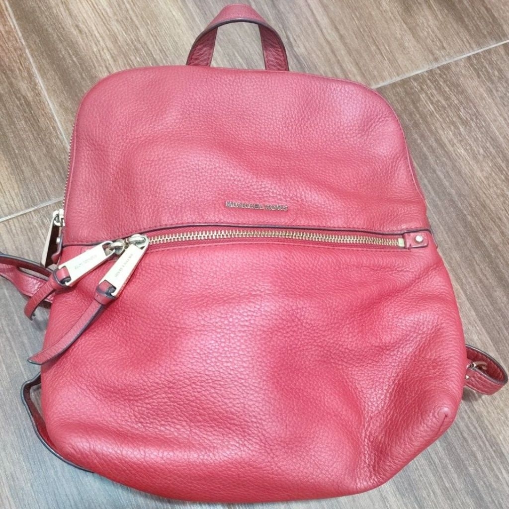 tas merah mk
