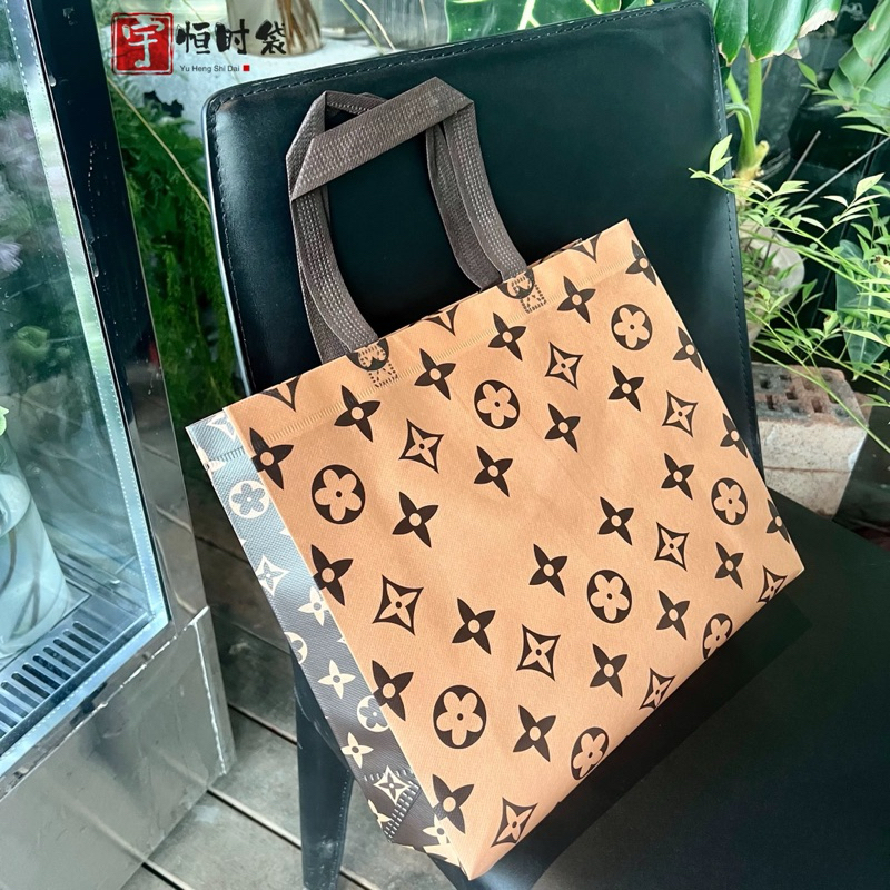 

Tas laminasi LV goodiebag tas branded