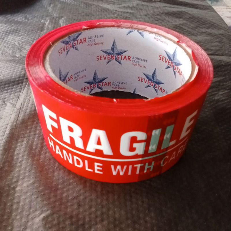 

isolas paket fragile merah unboxing lebar 48 mm merk SEVEN STAR