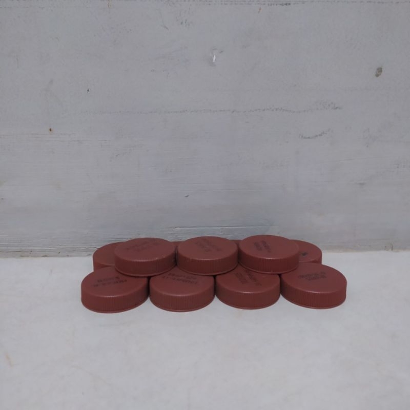 Tutup Botol Plastik Milku Cokelat Bekas Bersih