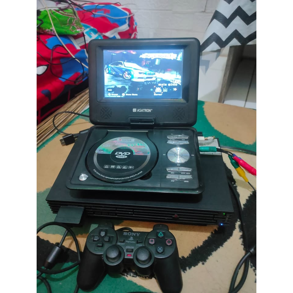 DVD player Portable 7inch merk Asatron Bisa dibuat STB dan PS