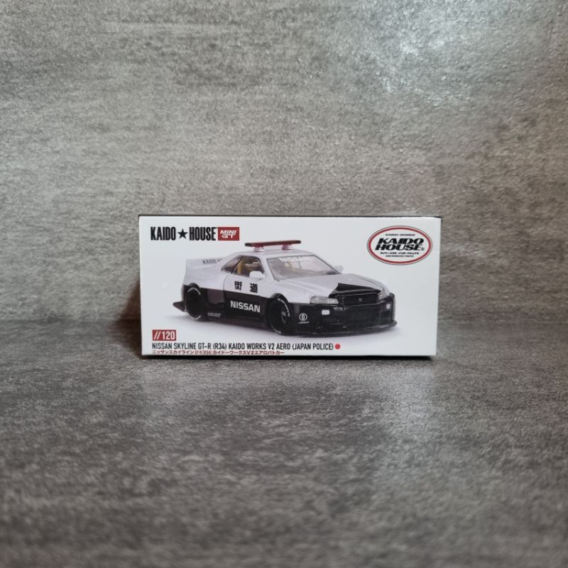 Mini gt kaido house nissan skyline GT-R (R34) kaido works V2 aero (japan police) sealed.