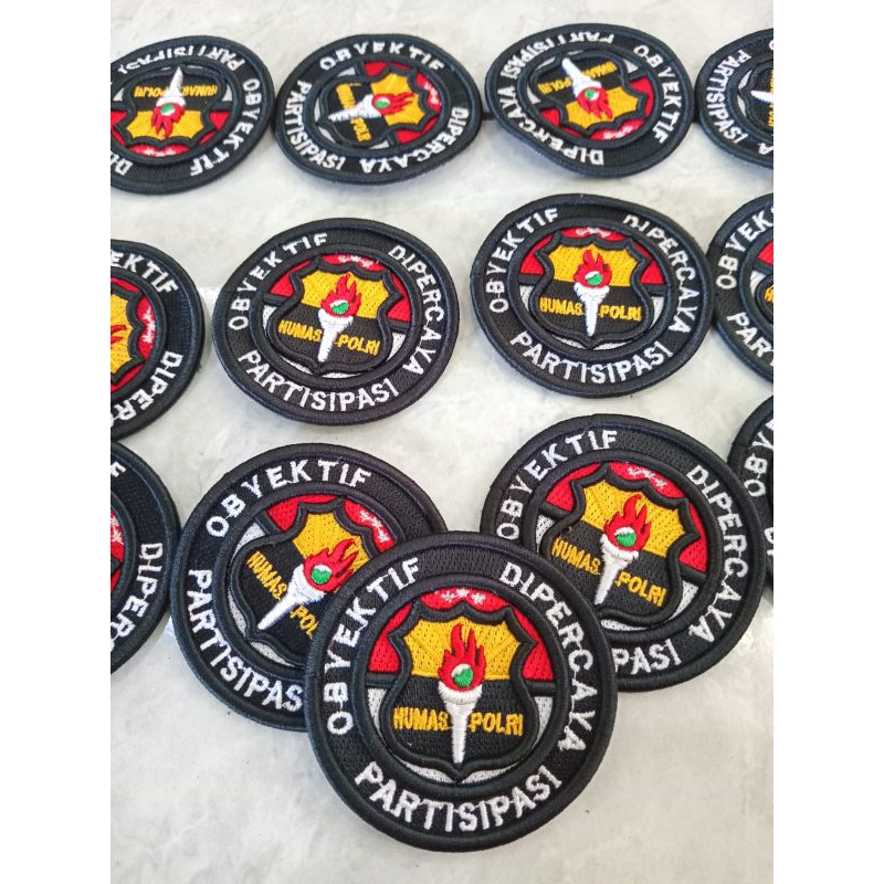 LOGO HUMAS POLRI DAN RODA SAKU HUMAS BORDIR