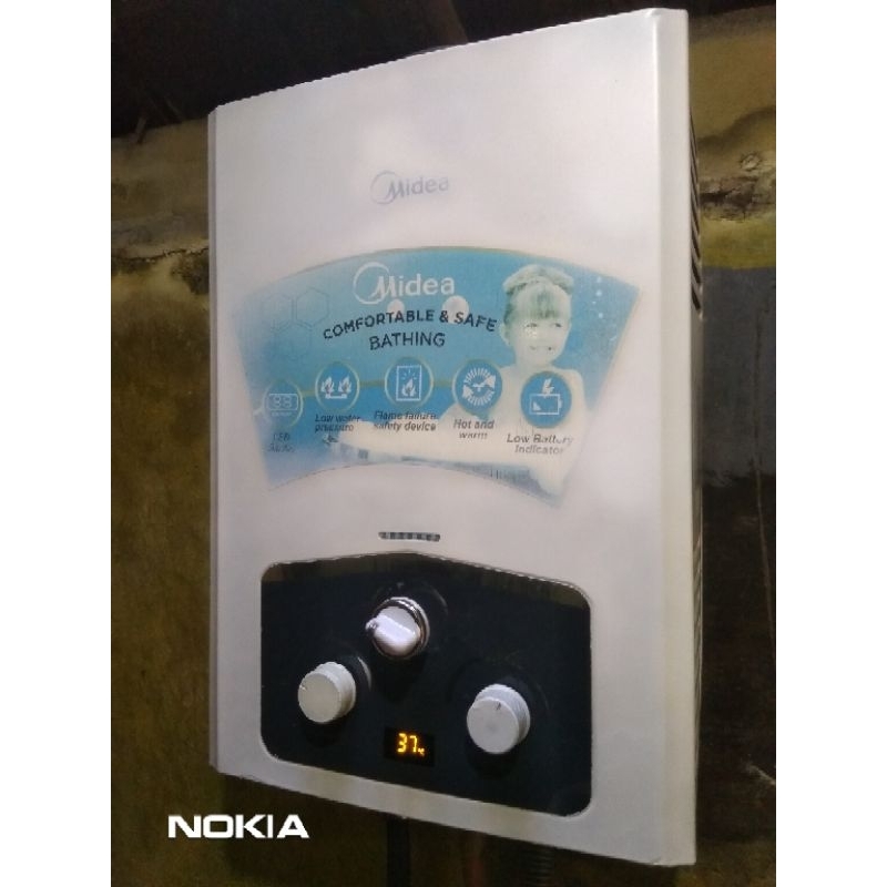 water heater midea bekas