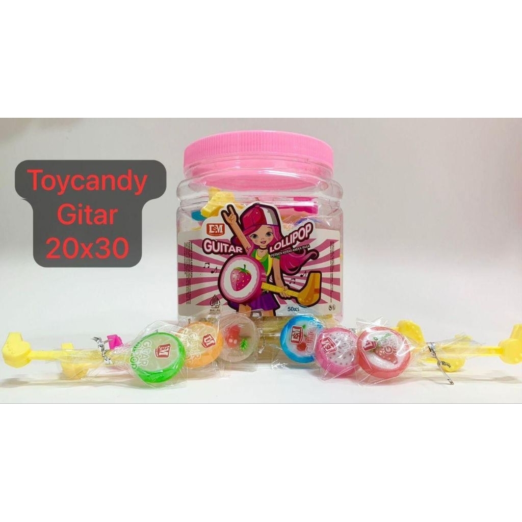 

Permen Cemilan Snack Gitar Lolipop Toy Candy Mainan Anak Murah (isi 30 pcs)