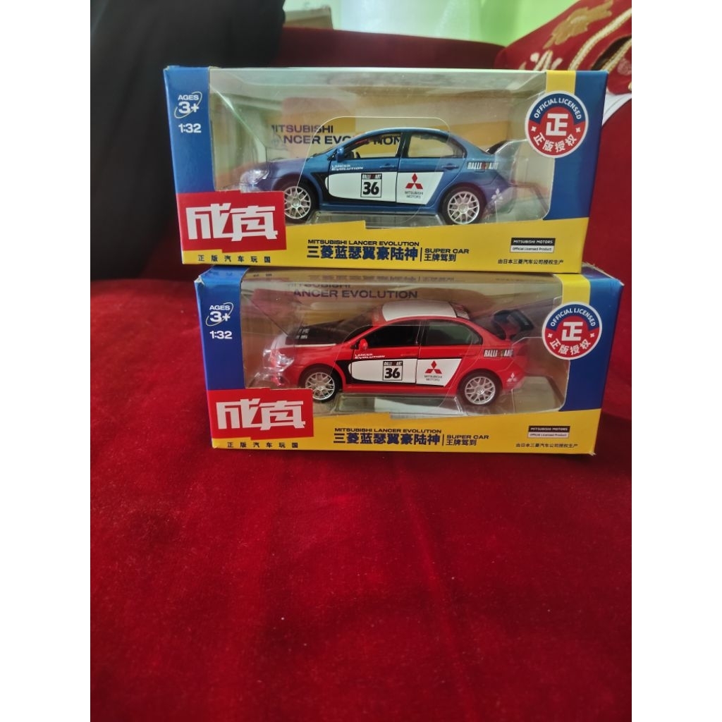 diecast mobil Mitsubishi Lancer Evolution merah dan biru