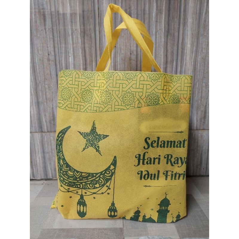 

Tas Tali Spunbond Parcel Idul Fitri bahan halus Ukuran 38x40