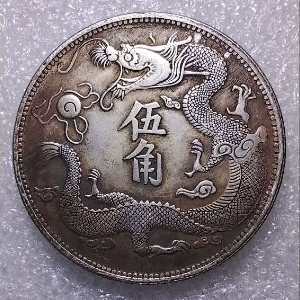 Koin Naga Cina uda bersih