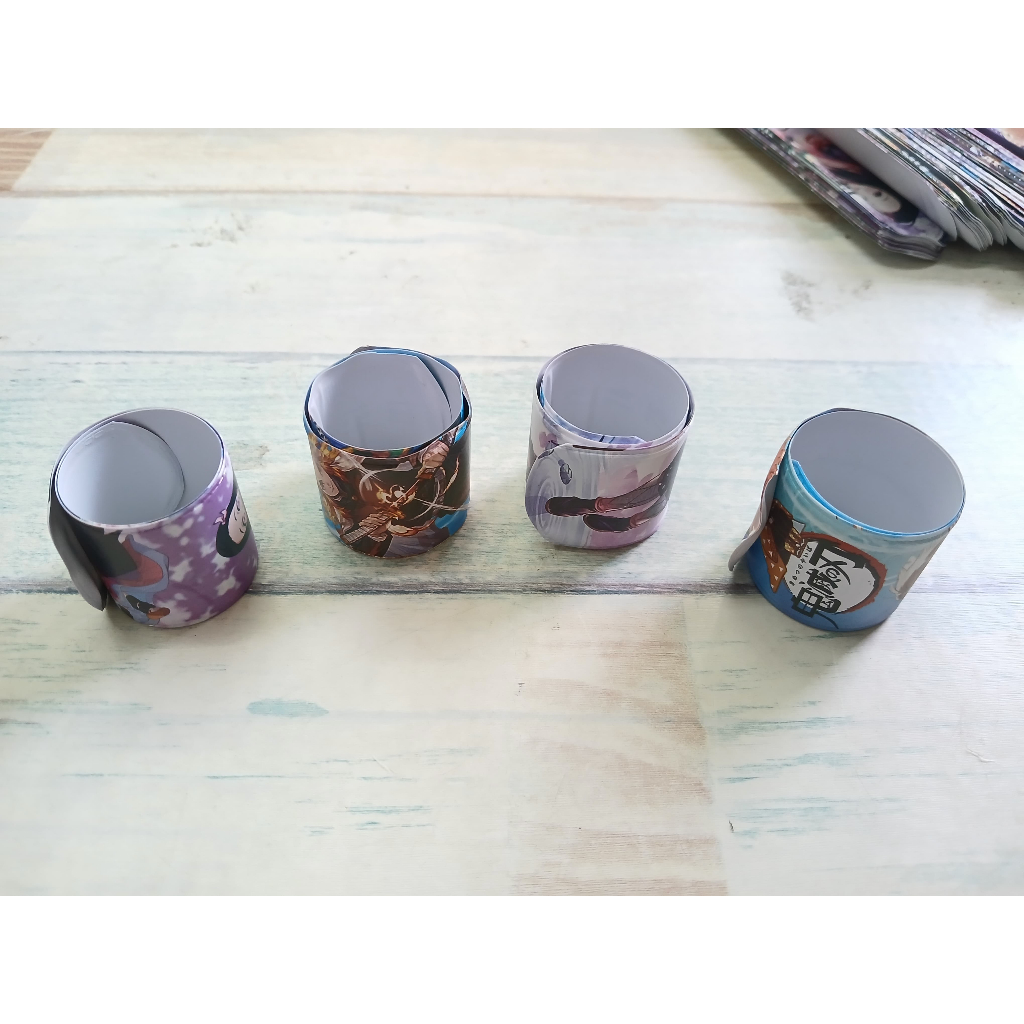 

YEN Grosir 50 Pcs Mainan Gelang Penggaris/Gelang Lipat/Gelang Bisa Dulung Motif Demon Slayer