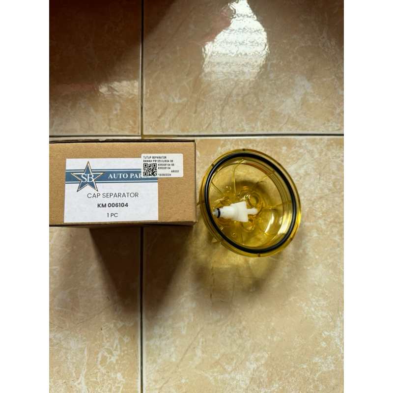 TUTUP SEPARATOR BAWAH CANTER EURO4 KM006104