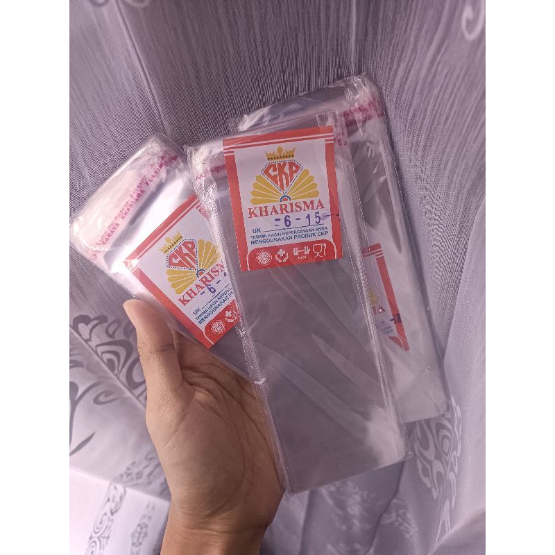 

PLASTIK OPP Lem 6x15 TRANSPARANT KHARISMA / PLASTIK OPP SEAL LEM UNTUK ROTI SOUVENIR