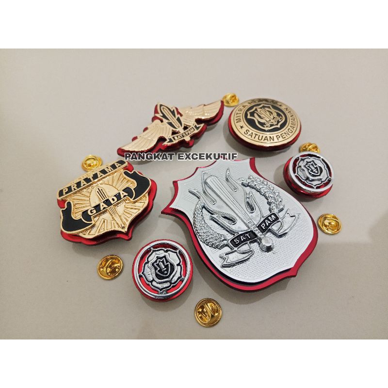 PIN GADA PRATAMA - KEWENANGAN SATPAM - MONOGRAM SATPAM - WING SATPAM - MITRA POLRI