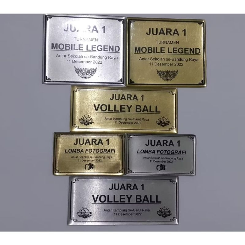

Emblem label piala atau tropy bahan stainless dan kuningan