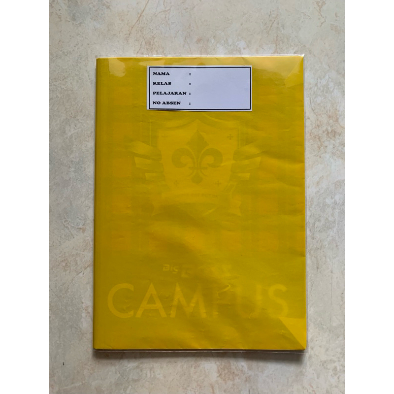 

buku tulis sudah disampul sukung warna kuning dan sampul plastik