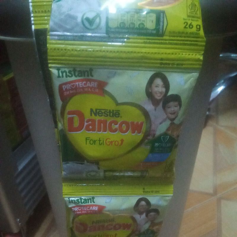 

susu bubuk Dancow rasa full cream 26 g 1 renceng