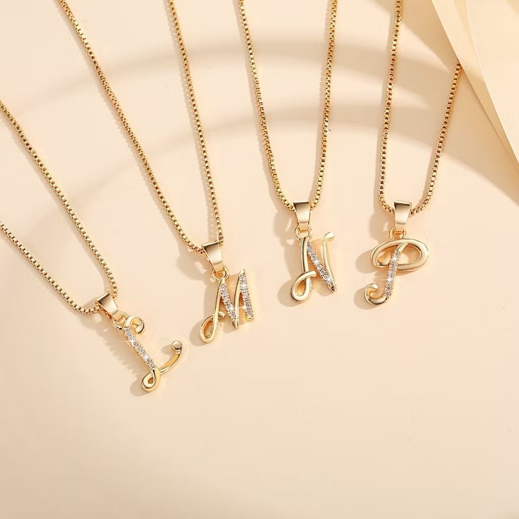 Kalung titanium huruf wanita anti karat lapis emas perhiasan anti karat