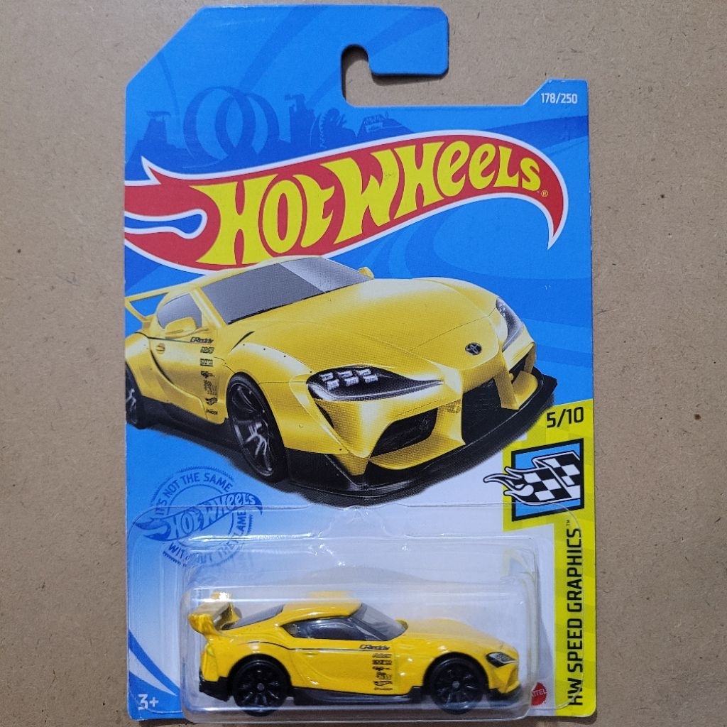 HOT WHEELS [ KEMASAN KERUT/TEKUK ] '20 TOYOTA GR SUPRA / HW SPEED GRAPHICS [ YELLOW ] - MAINAN MOBIL