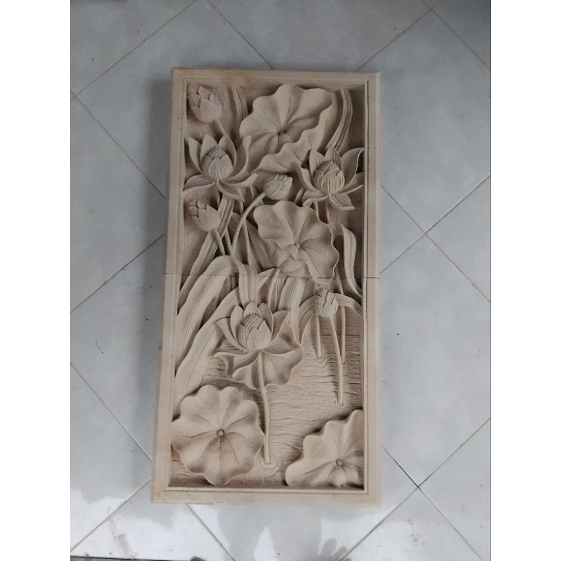 relief batu alsm motif bunga lotus