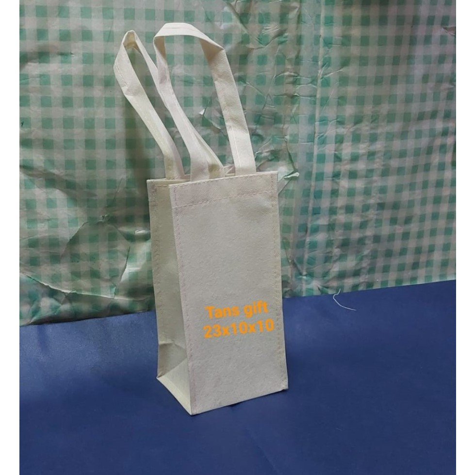 

Goody Bag Spunbond ukuran Botol T= 23X10X10 /75 - cream