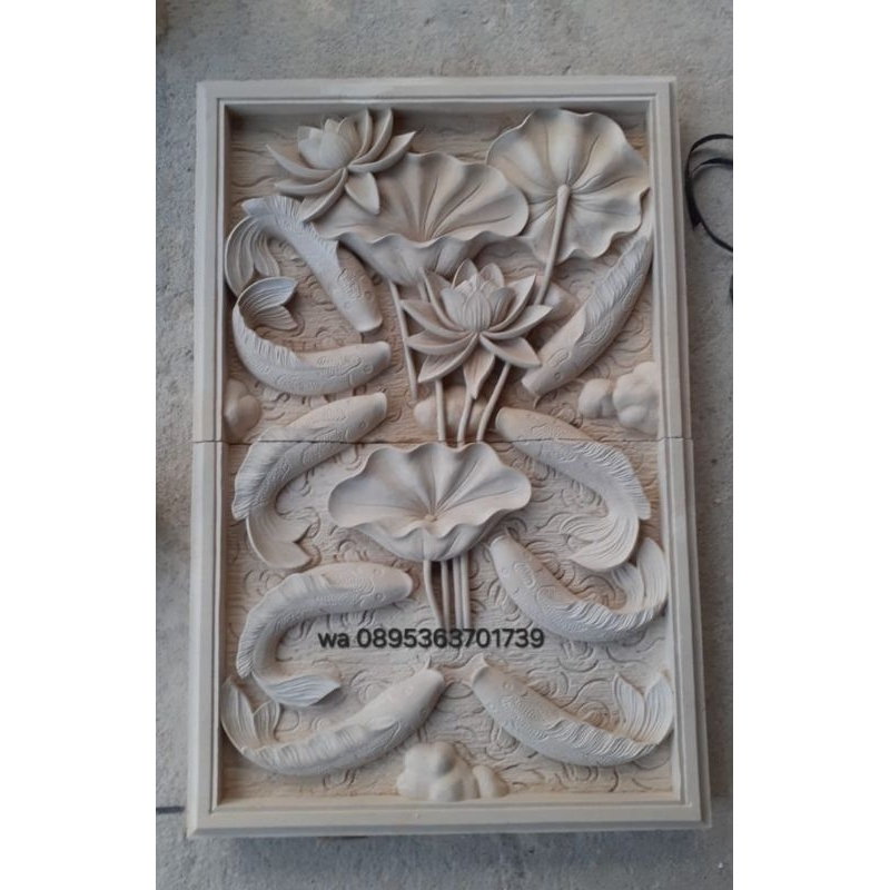 ukiran batu alam motif ikan