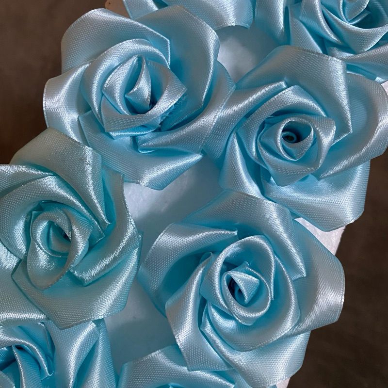 

bunga pita satin glitar