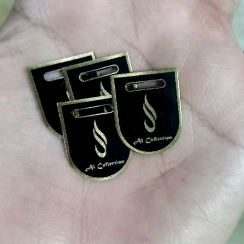 

costum label/label plat hijab/label plat besi/model bandul