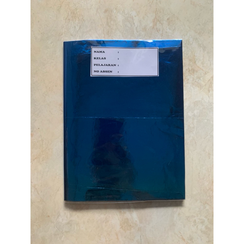 buku tulis sudah disampul sukung warna biru gilap dan sampul plastik